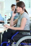 Woman in wheelchair with phone